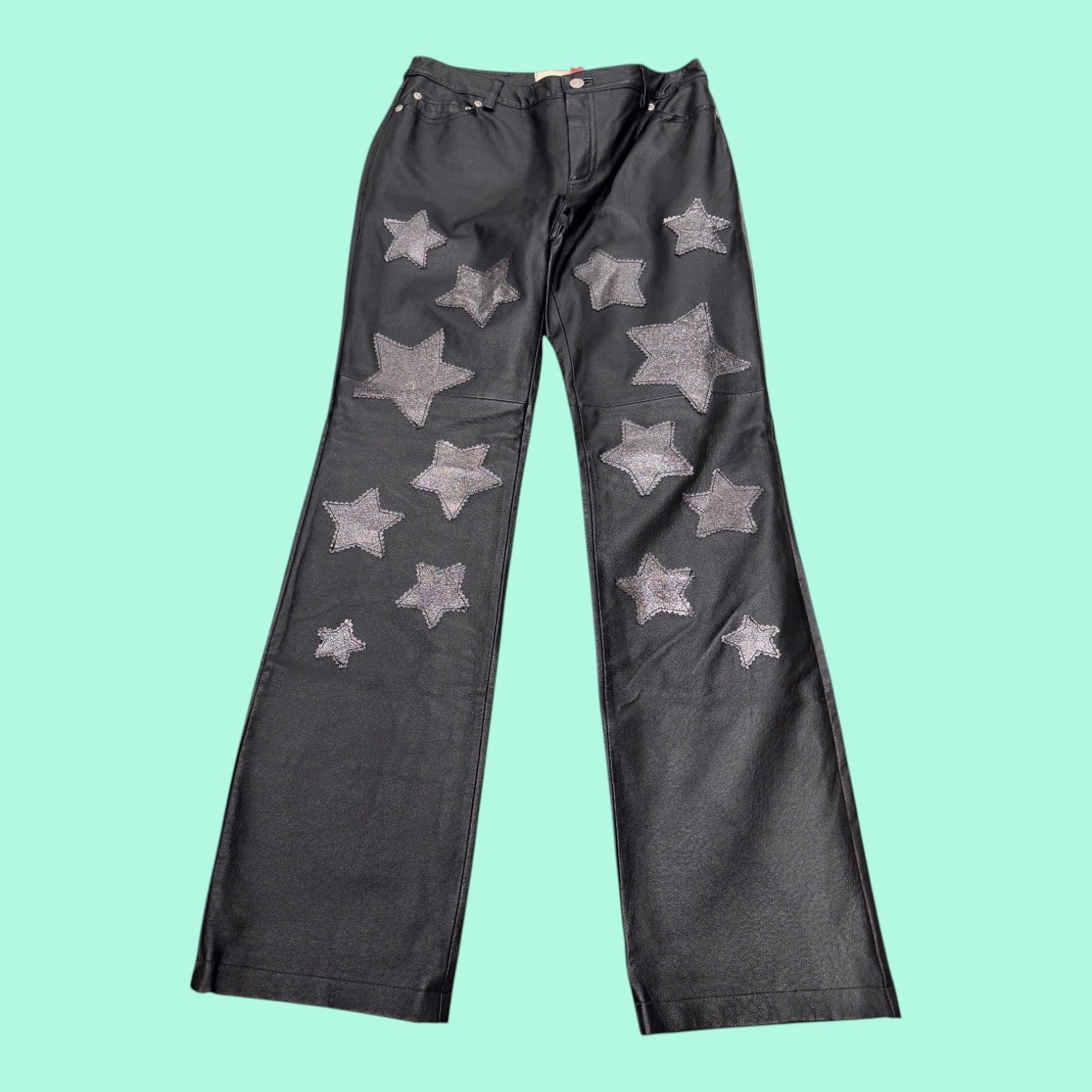Blue Greenie black wide-leg leather pants with sparkling silver star applique details on the front