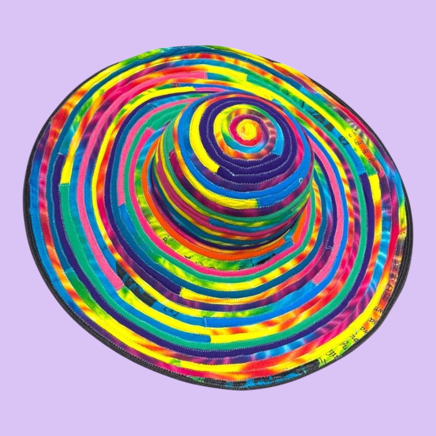Blue Greenie large brim hat made from colorful tie-dye t-shirt strips in a spiral pattern, 19.5 inch diameter.