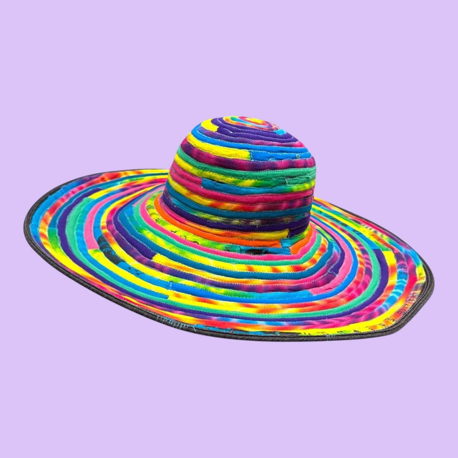 Blue Greenie large brim hat crafted from colorful tie-dye t-shirt fabric strips in a spiral pattern