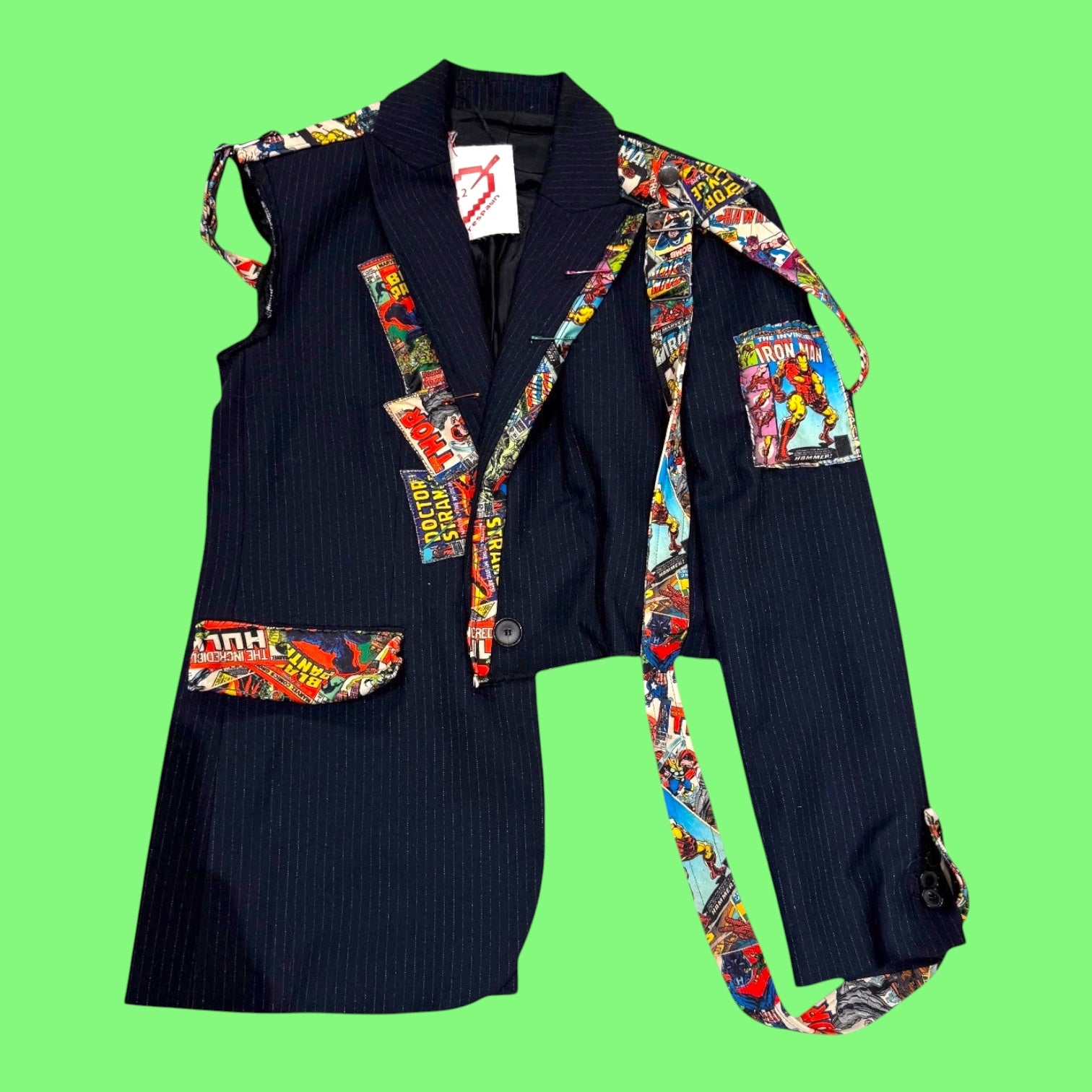 Blue Greenie deconstructed pinstripe blazer featuring colorful Marvel comic book character patches and hanging straps.