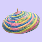 Blue Greenie pastel tie-dye beret made from coiled t-shirt fabric strips in a spiral pattern on an eggshell base.