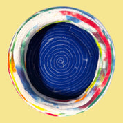 Blue Greenie blue beret with colorful tie-dye t-shirt strip trim, size L, top-down view