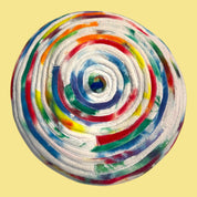 Blue Greenie beret made from coiled tie-dye t-shirt fabric strips in a vibrant multi-colored spiral pattern.