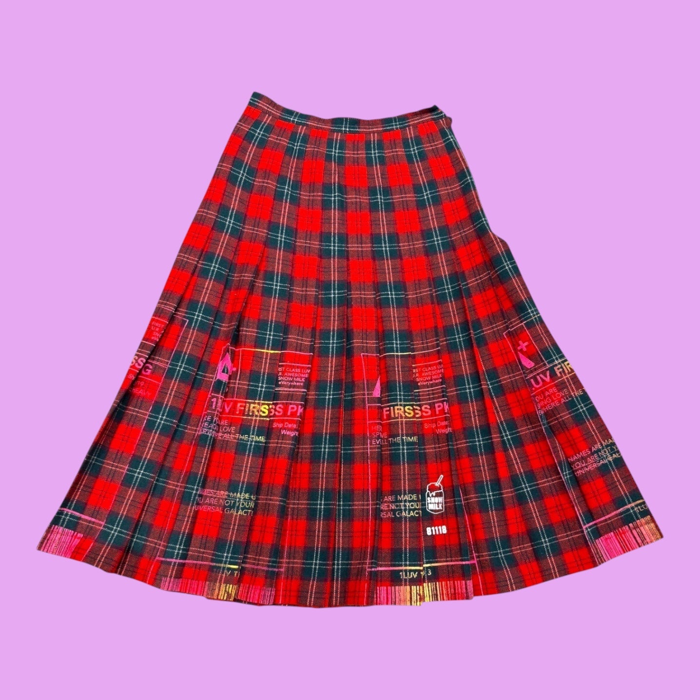 Blue Greenie vintage Lennox tartan wool pleated skirt with red and green plaid pattern and graphic postage details.